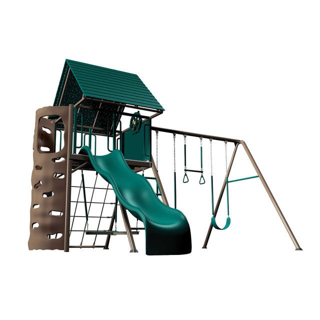 Green and brown playset features a slide, climbing wall, swings, and a small, covered platform.