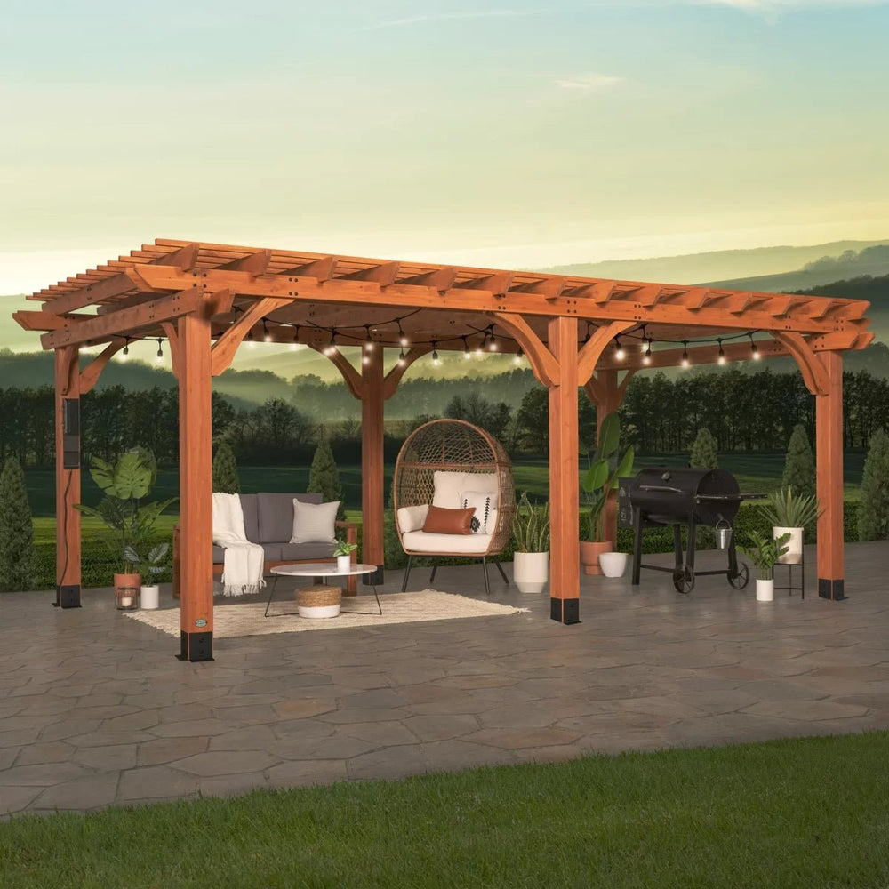 Wooden pergola with outdoor furniture including a sofa, egg chair, coffee table, grill, and string lights.