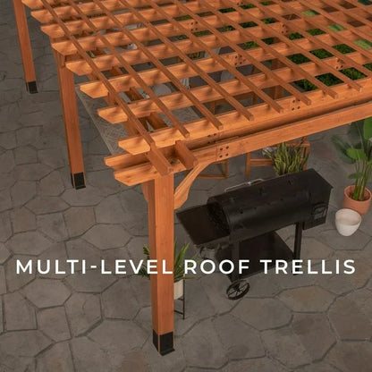Wooden pergola with a grill and plants on a stone patio.